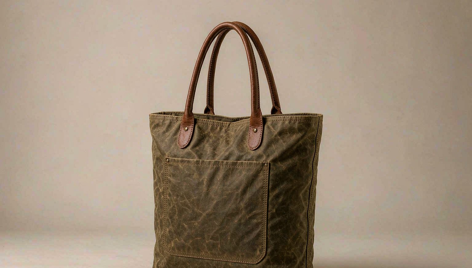 Olive waxed canvas tote bag with leather handles for travel